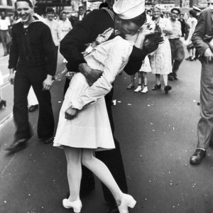 NEW YORK, UNITED STATES - AUGUST 14: A jubilant American sailor clutching a white-uniformed nurse in a back-bending, passionate kiss as he vents his joy while thousands jam Times Square to celebrate the long awaited-victory over Japan. (Photo by Alfred Eisenstaedt/Pix Inc./Time & Life Pictures/Getty Images)